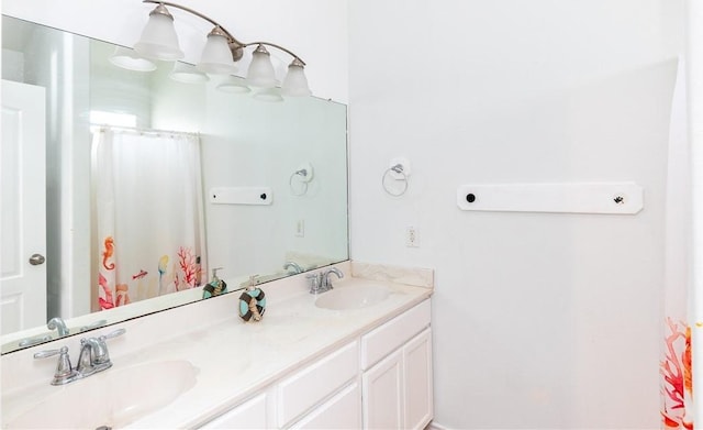 bathroom with double vanity and a sink