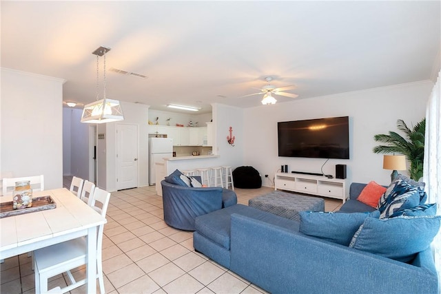 living area with light tile patterned floors, a ceiling fan, visible vents, and crown molding