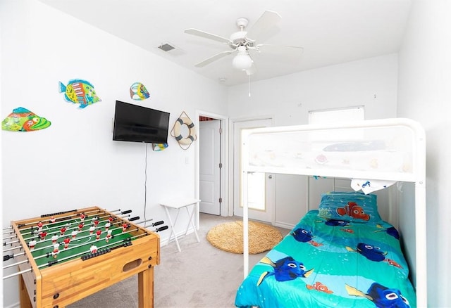 bedroom with ceiling fan, carpet floors, and visible vents