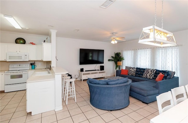 living room with ceiling fan, visible vents, crown molding, and light tile patterned flooring