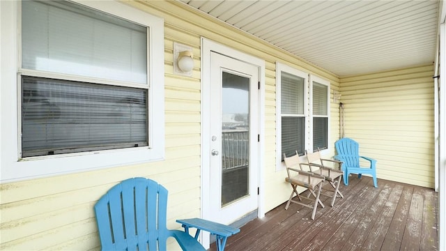 wooden terrace with a porch