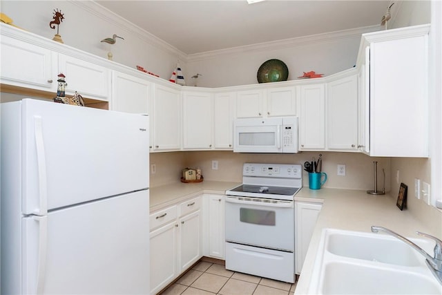 kitchen featuring white appliances, ornamental molding, light countertops, a sink, and light tile patterned flooring