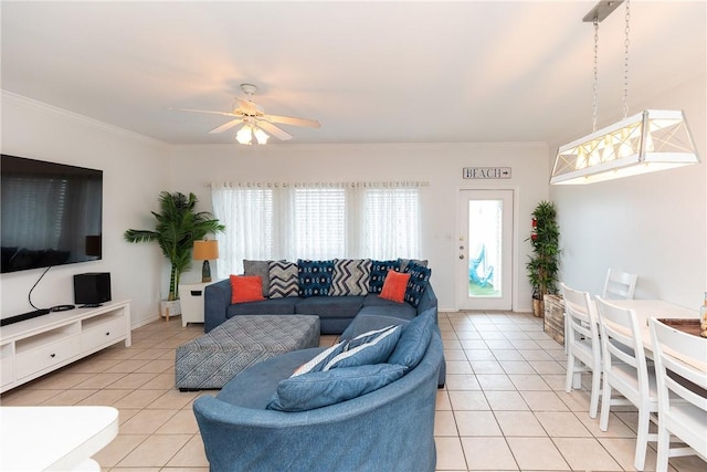 living area featuring crown molding, a wealth of natural light, and light tile patterned flooring