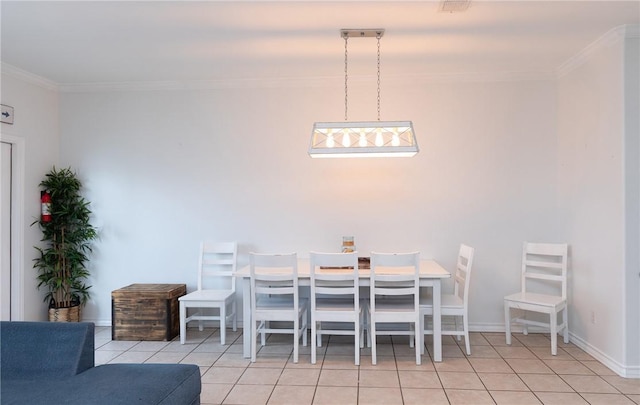 unfurnished dining area featuring crown molding, baseboards, and light tile patterned floors