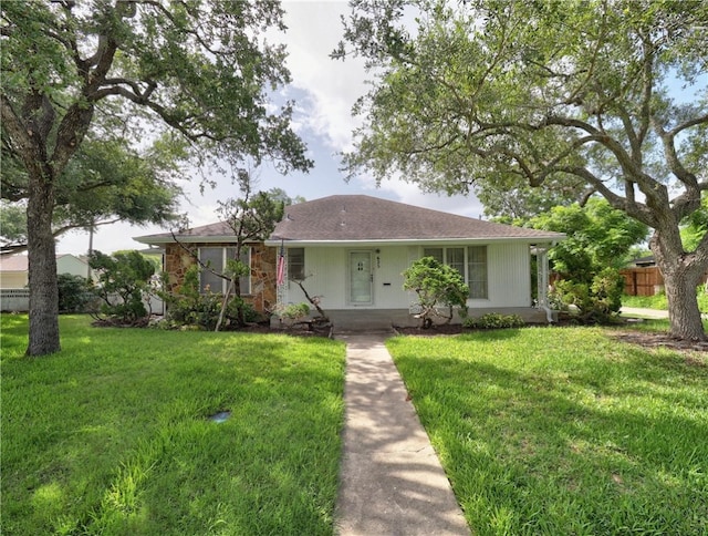 single story home with a porch and a front yard