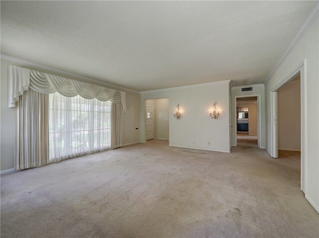 interior space featuring carpet flooring, a textured ceiling, and crown molding