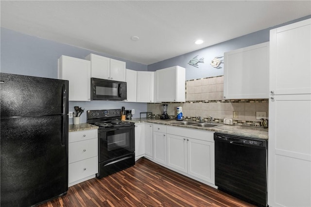 kitchen featuring dark hardwood / wood-style floors, sink, white cabinets, and black appliances