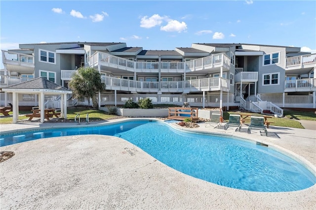 view of pool featuring a gazebo and a patio