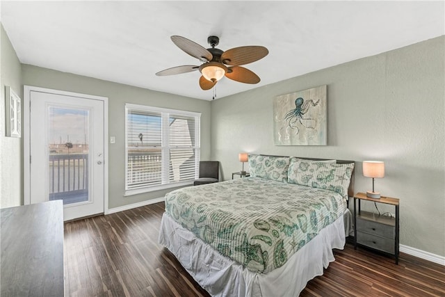 bedroom with ceiling fan, access to exterior, and dark wood-type flooring