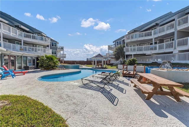 view of swimming pool featuring a patio area and a gazebo