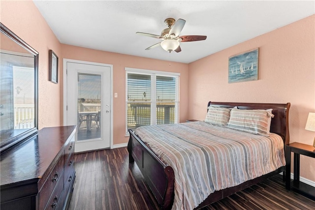 bedroom featuring ceiling fan, dark hardwood / wood-style flooring, and access to outside