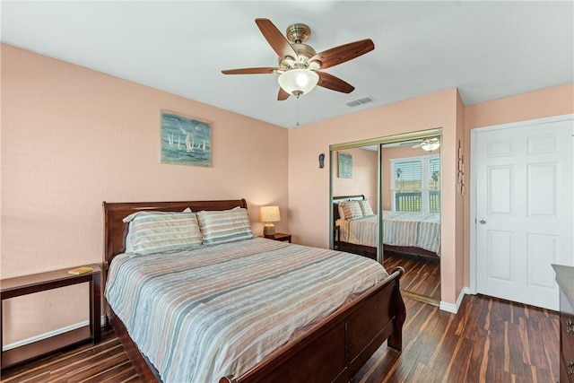 bedroom featuring ceiling fan, a closet, and dark hardwood / wood-style floors