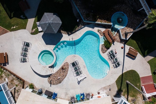 view of swimming pool with a patio