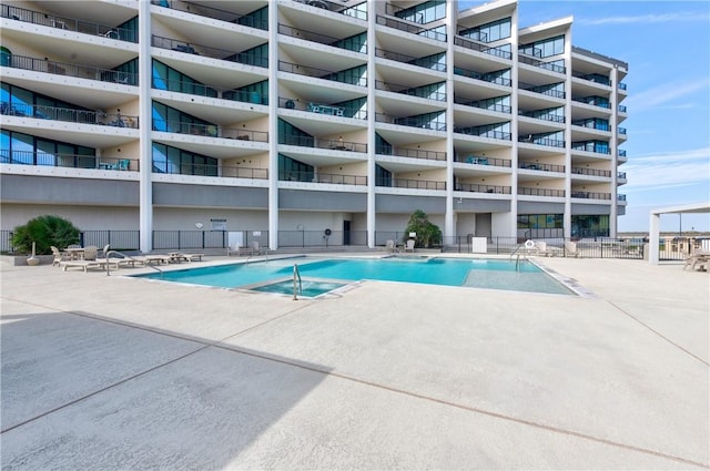 view of swimming pool with a patio