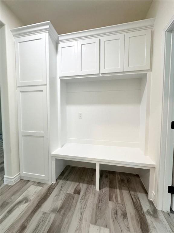 mudroom with wood finished floors