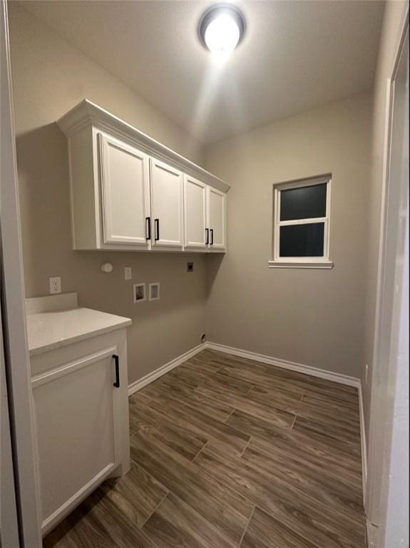 3141 Quail Springs Rd Unit 14, Corpus Christi, TX 78414 - laundry area with cabinet space, electric dryer hookup, washer hookup, baseboards, and dark wood finished floors