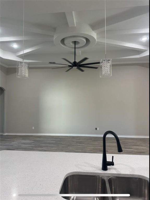 3141 Quail Springs Rd Unit 14, Corpus Christi, TX 78414 - kitchen featuring a sink, coffered ceiling, light stone countertops, baseboards, and beamed ceiling