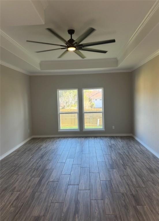 3141 Quail Springs Rd Unit 14, Corpus Christi, TX 78414 - empty room with a raised ceiling, dark wood-type flooring, ceiling fan, baseboards, and ornamental molding