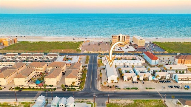 bird's eye view with a water view and a view of the beach