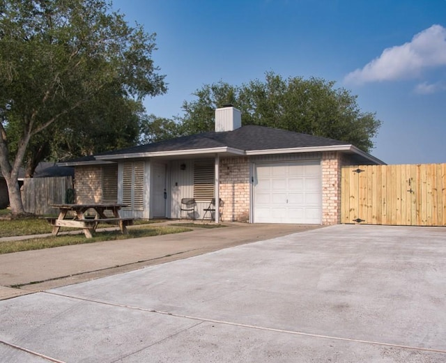 2850 Tuscarora Dr, Corpus Christi, TX 78410 - ranch-style home featuring an attached garage and concrete driveway