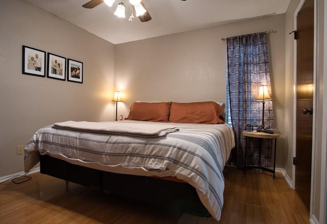 2850 Tuscarora Dr, Corpus Christi, TX 78410 - bedroom with wood finished floors, baseboards, and ceiling fan