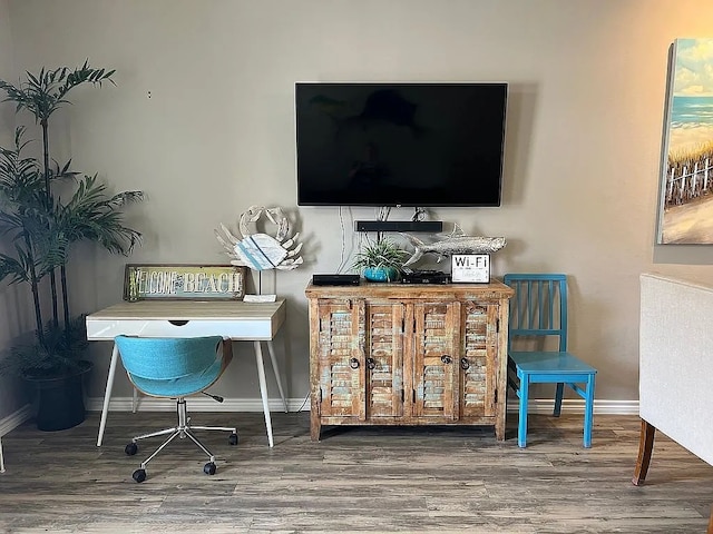 home office with hardwood / wood-style floors