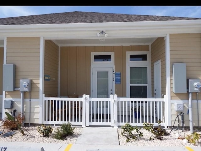 property entrance featuring covered porch