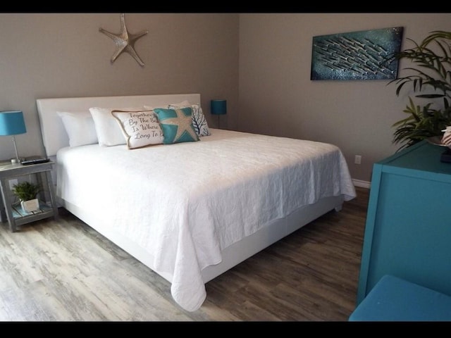 bedroom featuring hardwood / wood-style floors