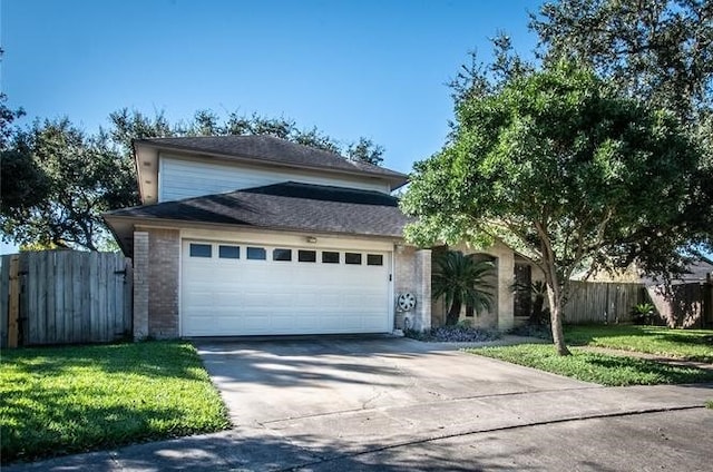 view of front facade with a front lawn and a garage