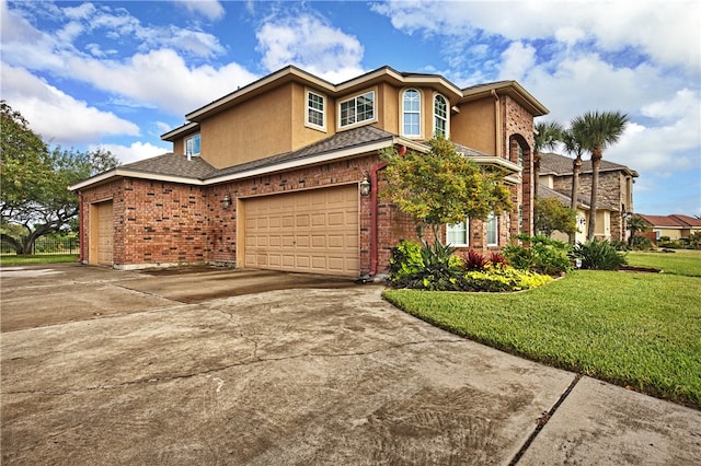 view of front of home featuring a garage and a front lawn