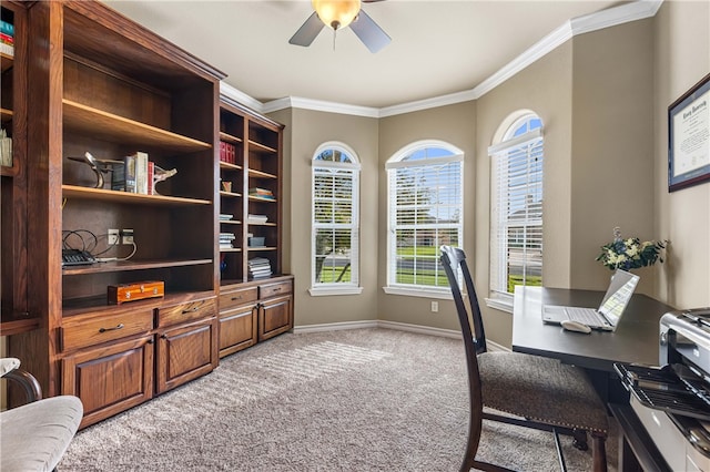 office space featuring crown molding, ceiling fan, and light colored carpet