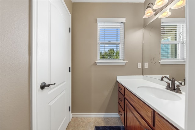 bathroom with tile patterned flooring and vanity