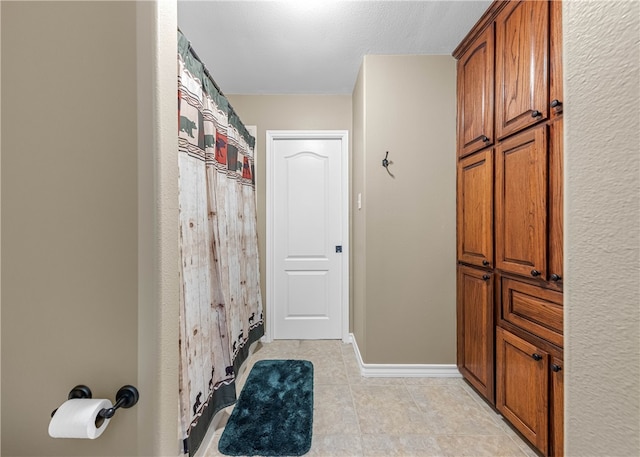 bathroom featuring tile patterned flooring and walk in shower