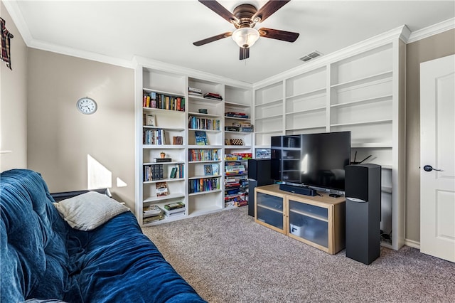 carpeted living room with crown molding and ceiling fan