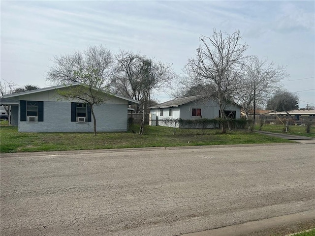 view of property exterior with a lawn