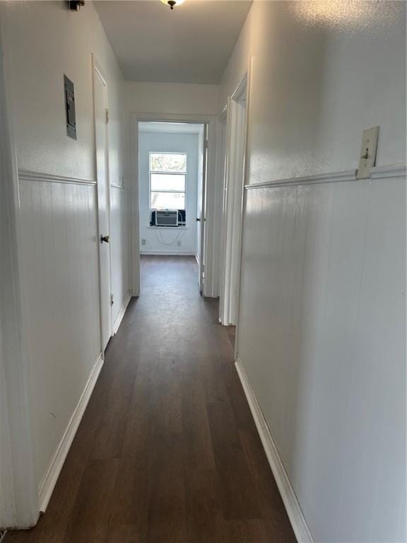 hallway featuring cooling unit and dark hardwood / wood-style flooring