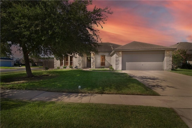 7002 Madiera Dr, Corpus Christi, TX 78414 - view of front facade with concrete driveway, a garage, a yard, and brick siding