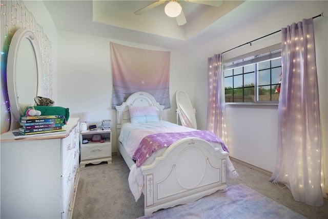 7002 Madiera Dr, Corpus Christi, TX 78414 - bedroom featuring carpet floors, a raised ceiling, and a ceiling fan