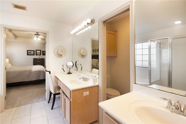 7002 Madiera Dr, Corpus Christi, TX 78414 - ensuite bathroom with ceiling fan, vanity, tile patterned floors, and an enclosed shower
