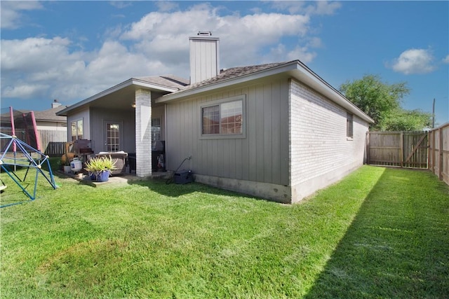 7002 Madiera Dr, Corpus Christi, TX 78414 - rear view of property featuring a chimney, a fenced backyard, and brick siding