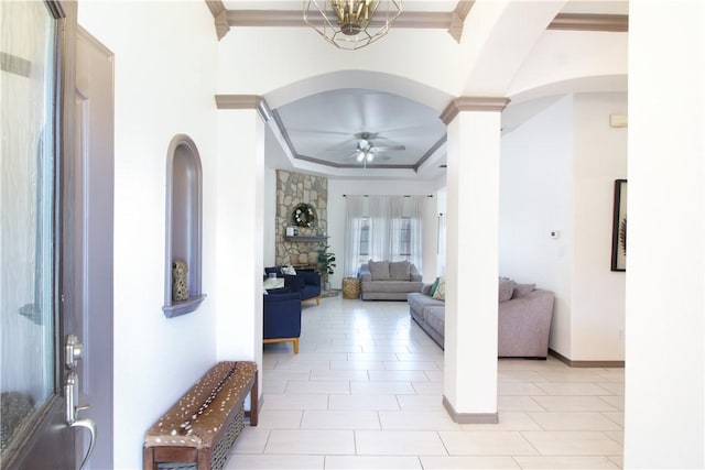 7002 Madiera Dr, Corpus Christi, TX 78414 - foyer entrance with crown molding, ceiling fan, arched walkways, ornate columns, and light tile patterned flooring