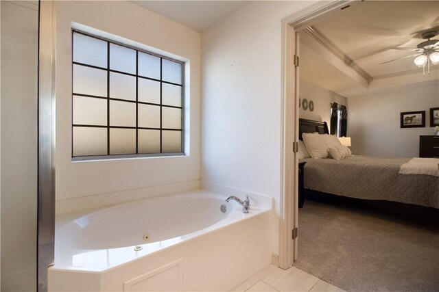 7002 Madiera Dr, Corpus Christi, TX 78414 - bathroom featuring ensuite bathroom, a jetted tub, tile patterned floors, and ceiling fan