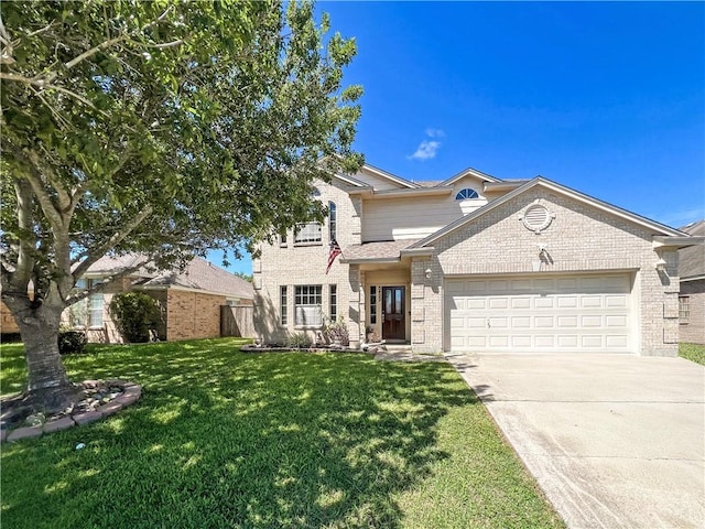 traditional home featuring a front yard, an attached garage, brick siding, and driveway