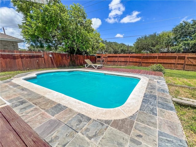 view of swimming pool featuring a fenced in pool, a fenced backyard, and a patio area