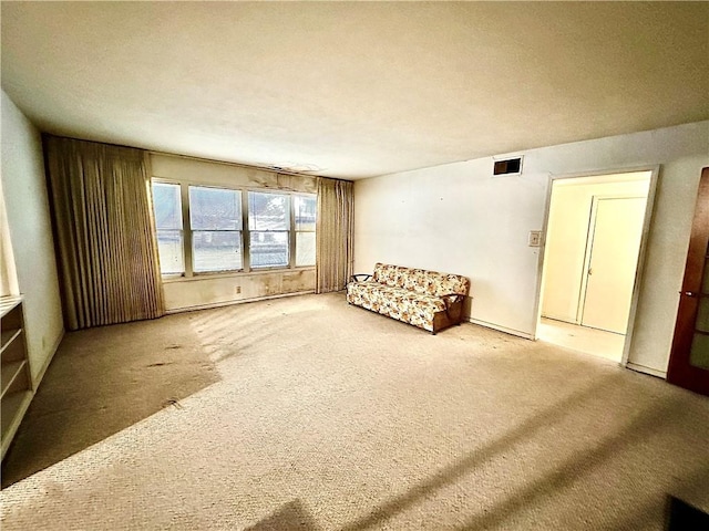 unfurnished room featuring carpet floors