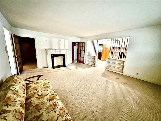 unfurnished living room featuring light carpet