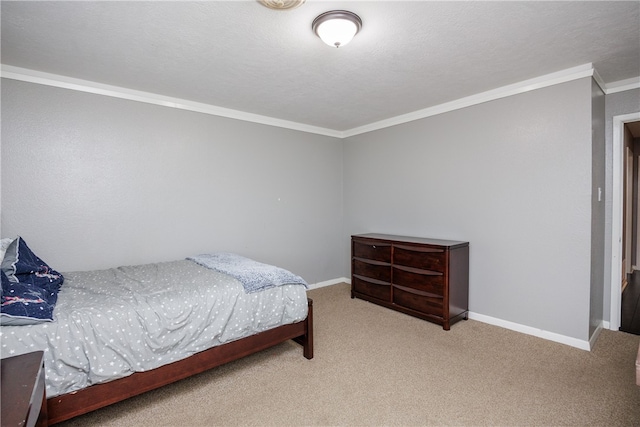 bedroom featuring carpet flooring, a textured ceiling, and ornamental molding