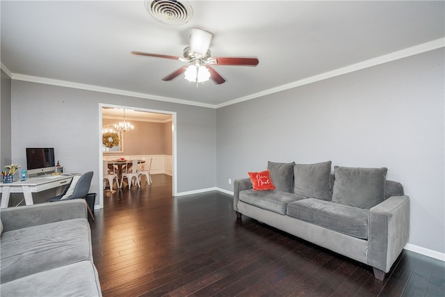 living room featuring ceiling fan with notable chandelier, dark hardwood / wood-style flooring, and ornamental molding