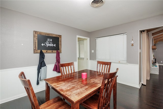 dining space with dark hardwood / wood-style floors