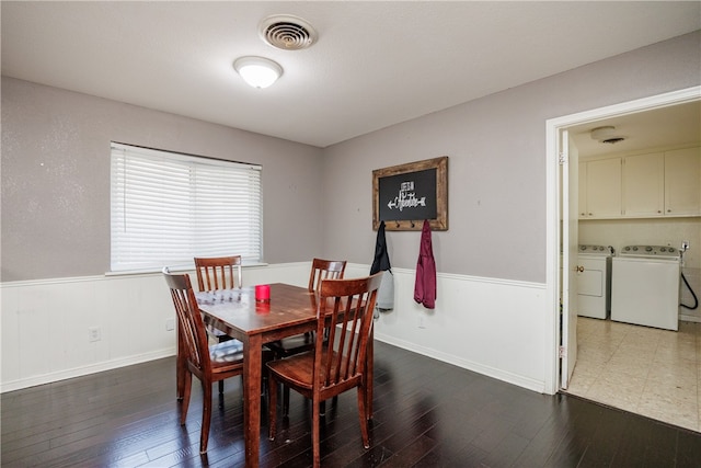 dining room with separate washer and dryer and dark wood-type flooring